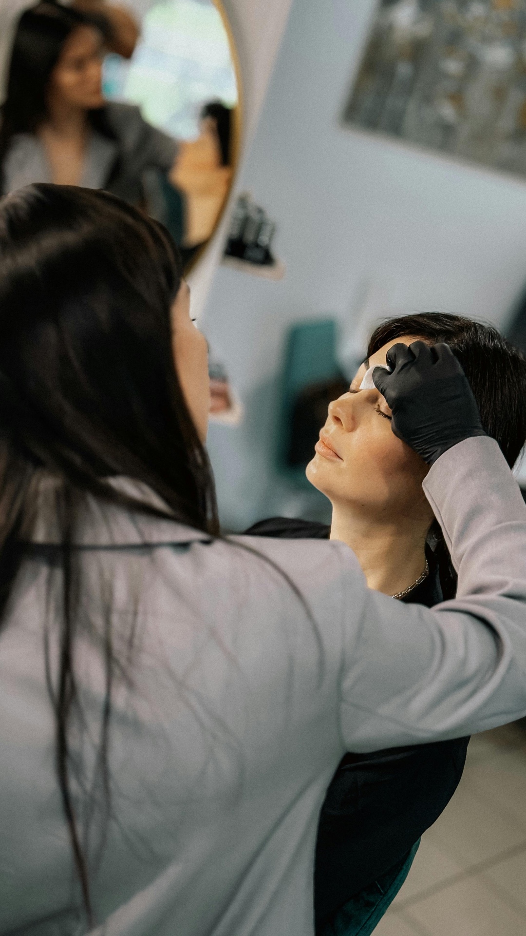 Esthetician performing a treatment